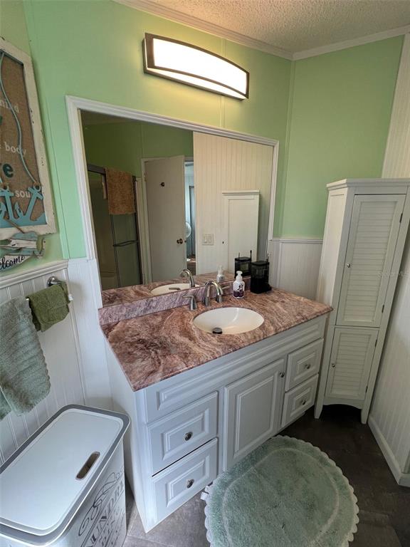 1001 Starkey Road, Unit 758 Largo, FL 33771 - Photo 30 of 37 a bathroom with a granite countertop sink a mirror and a toilet