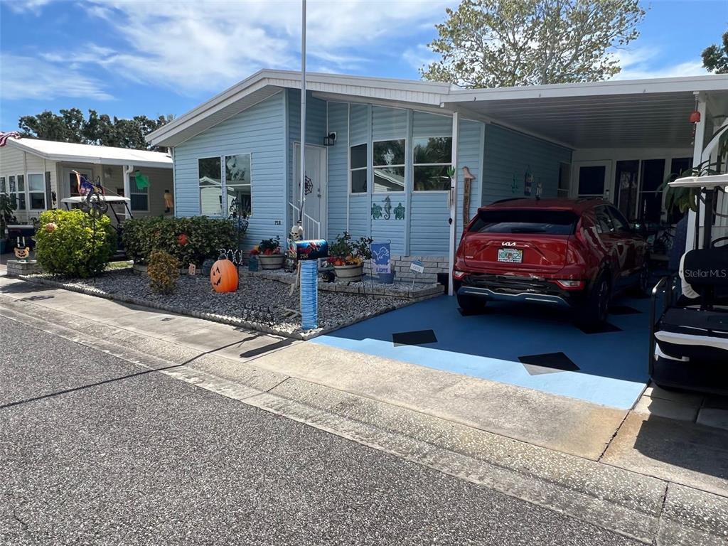 1001 Starkey Road, Unit 758 Largo, FL 33771 - Photo 3 of 37 a view of a car parked front of a house