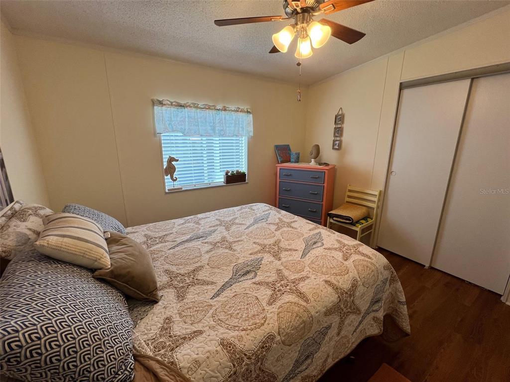 1001 Starkey Road, Unit 758 Largo, FL 33771 - Photo 33 of 37 a bedroom with a bed and a large window