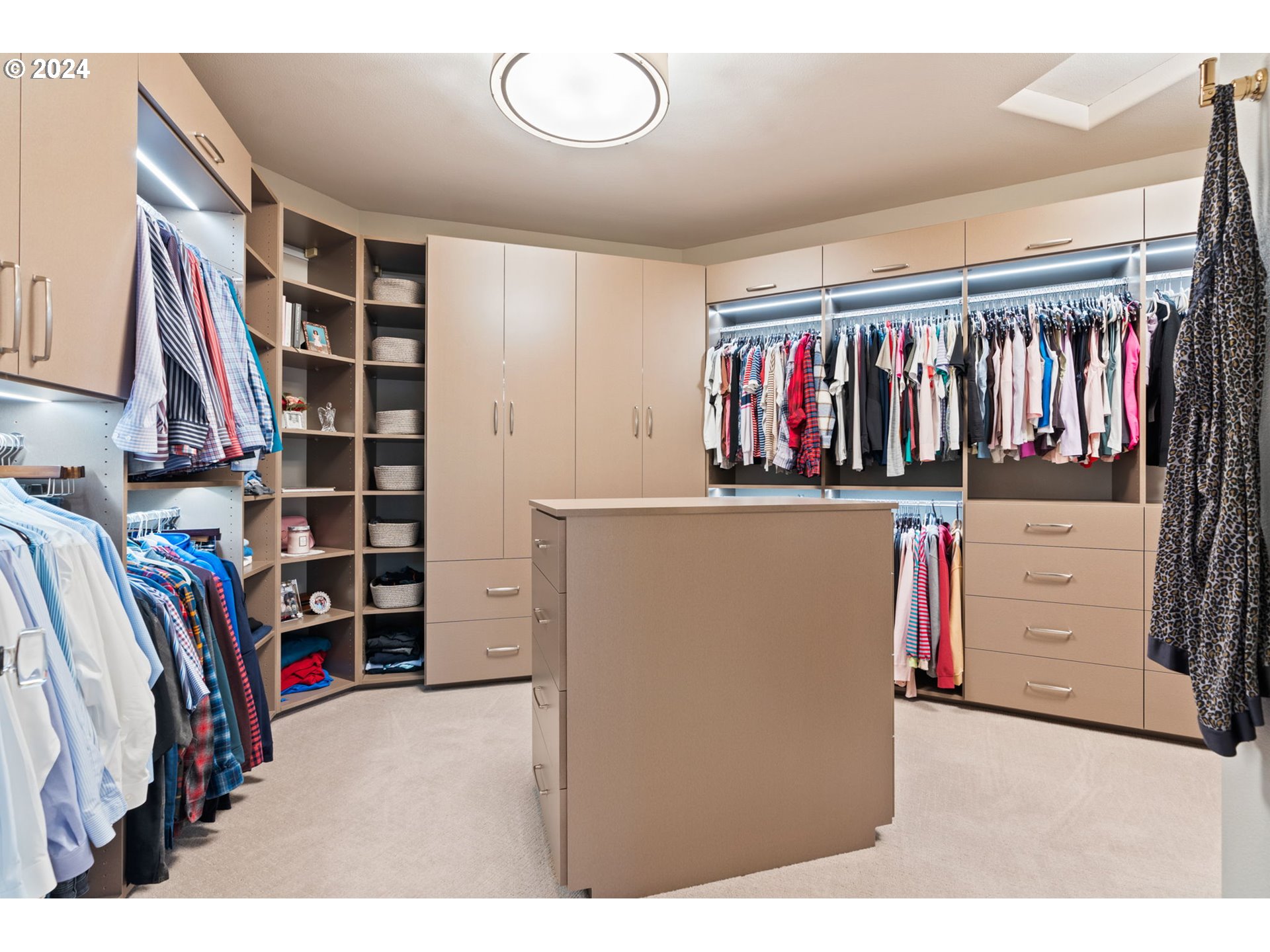 11800 Southeast Idleman Road Happy Valley, OR 97086 - Photo 32 of 46 a view of walk in closet with clothes and shoes
