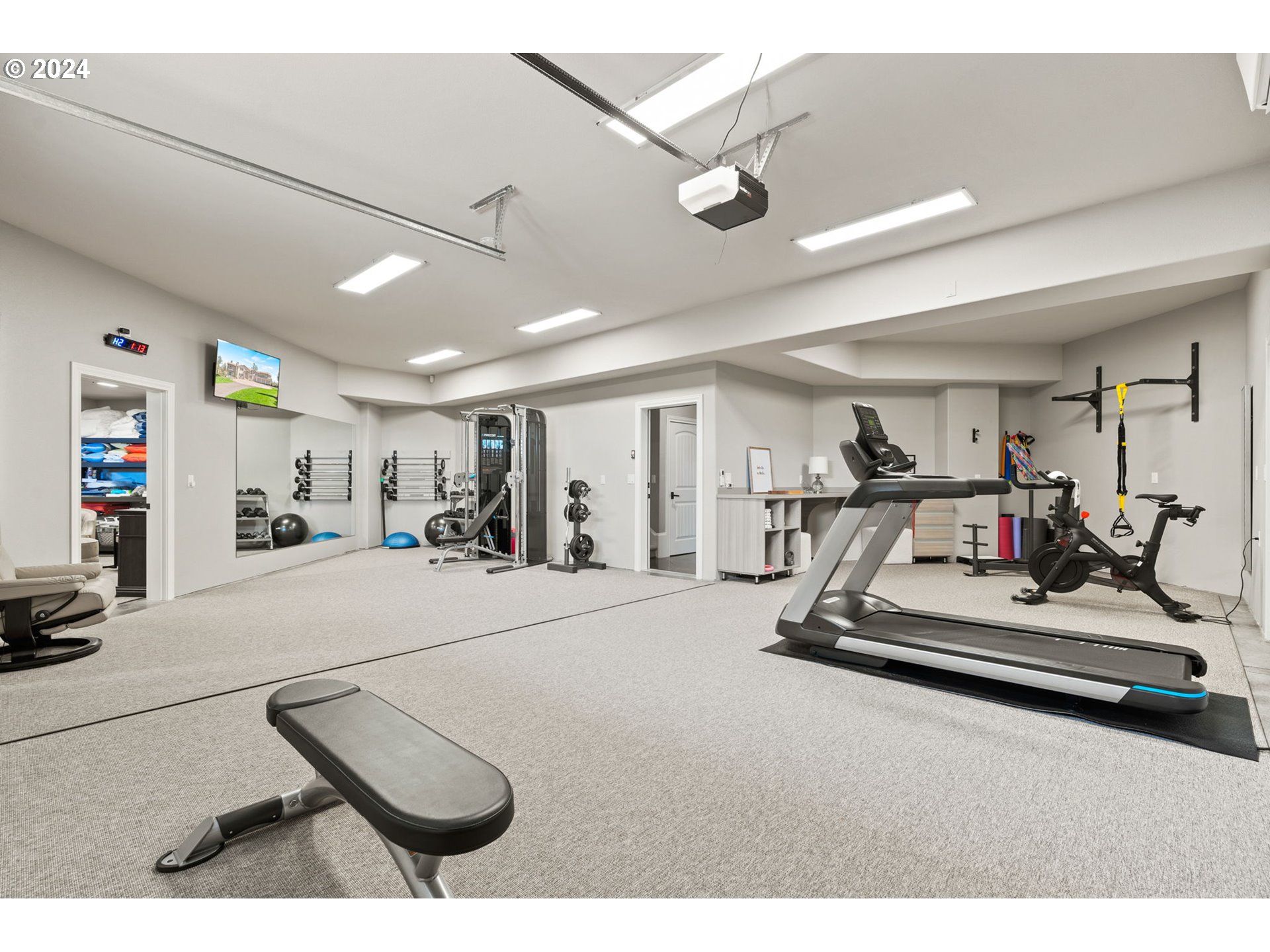 11800 Southeast Idleman Road Happy Valley, OR 97086 - Photo 38 of 46 a room with gym equipment and a large window
