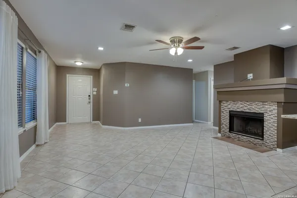 a view of an empty room with a fireplace