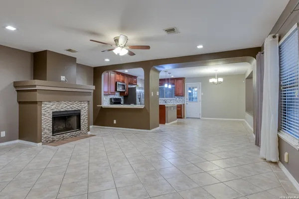 a view of a kitchen with a sink and a fireplace