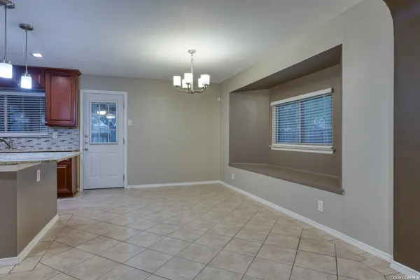 a kitchen with stainless steel appliances granite countertop a refrigerator a oven a sink and a oven