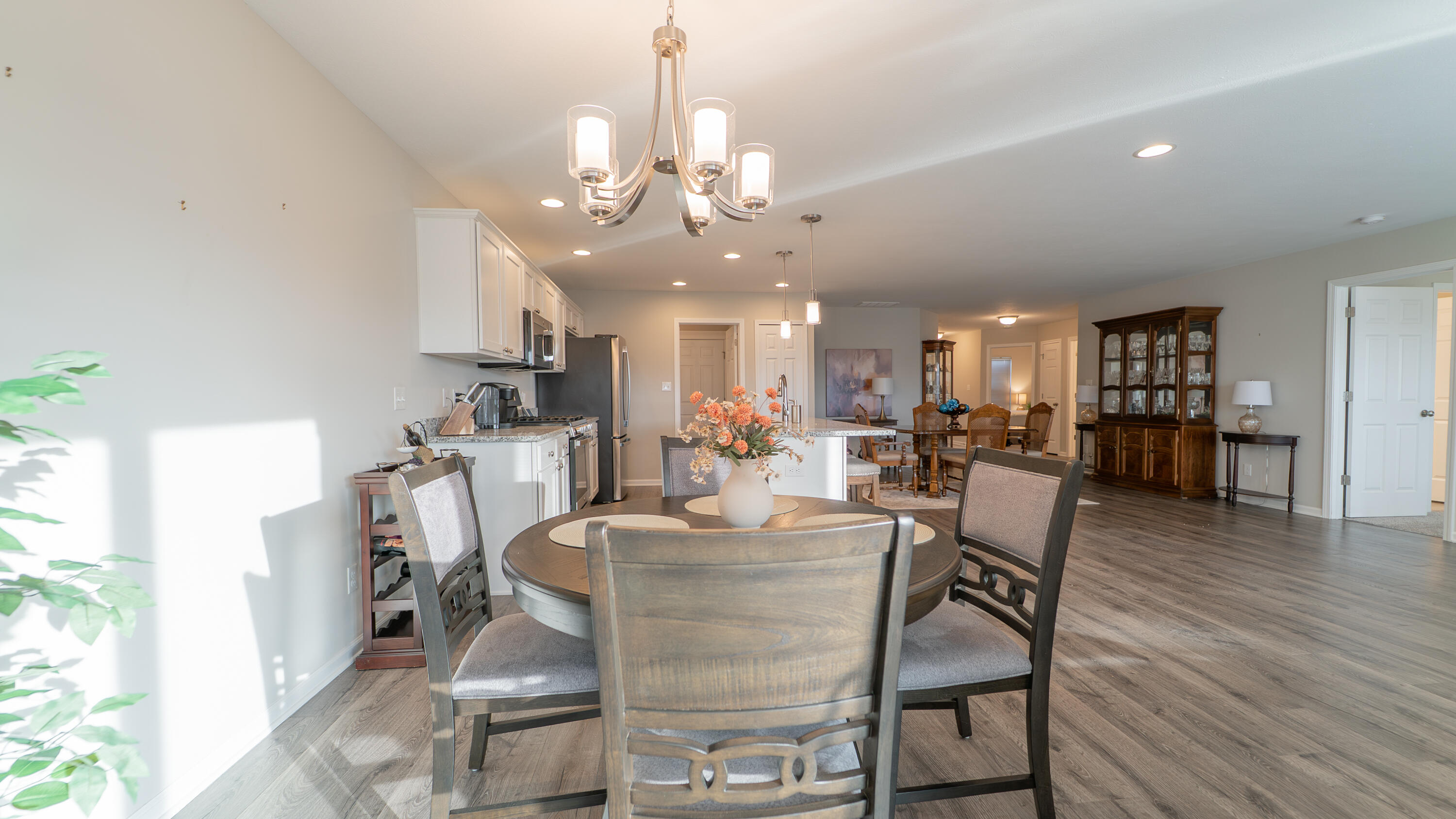 11792 Rhode Island Street Crown Point, IN 46307 - Photo 17 of 30 a view of a dining room with furniture and wooden floor