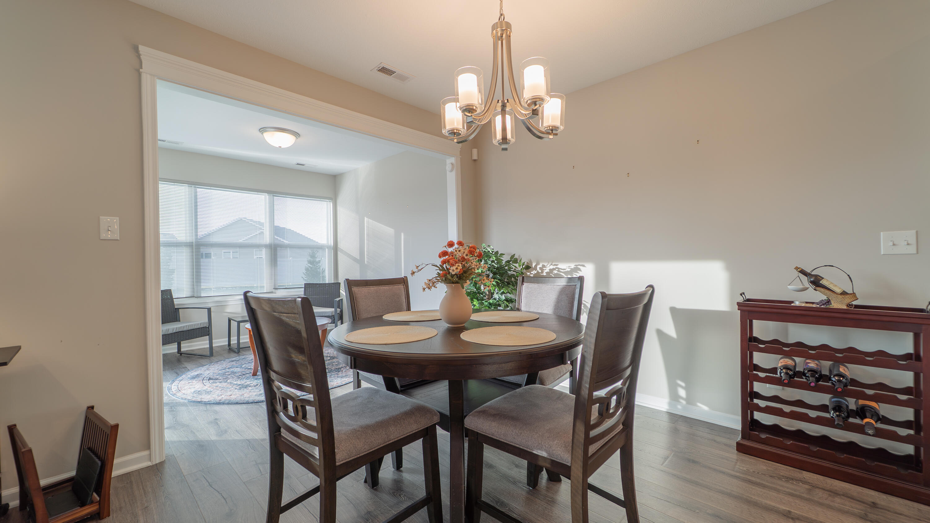 11792 Rhode Island Street Crown Point, IN 46307 - Photo 18 of 30 a view of a dining room with furniture and chandelier