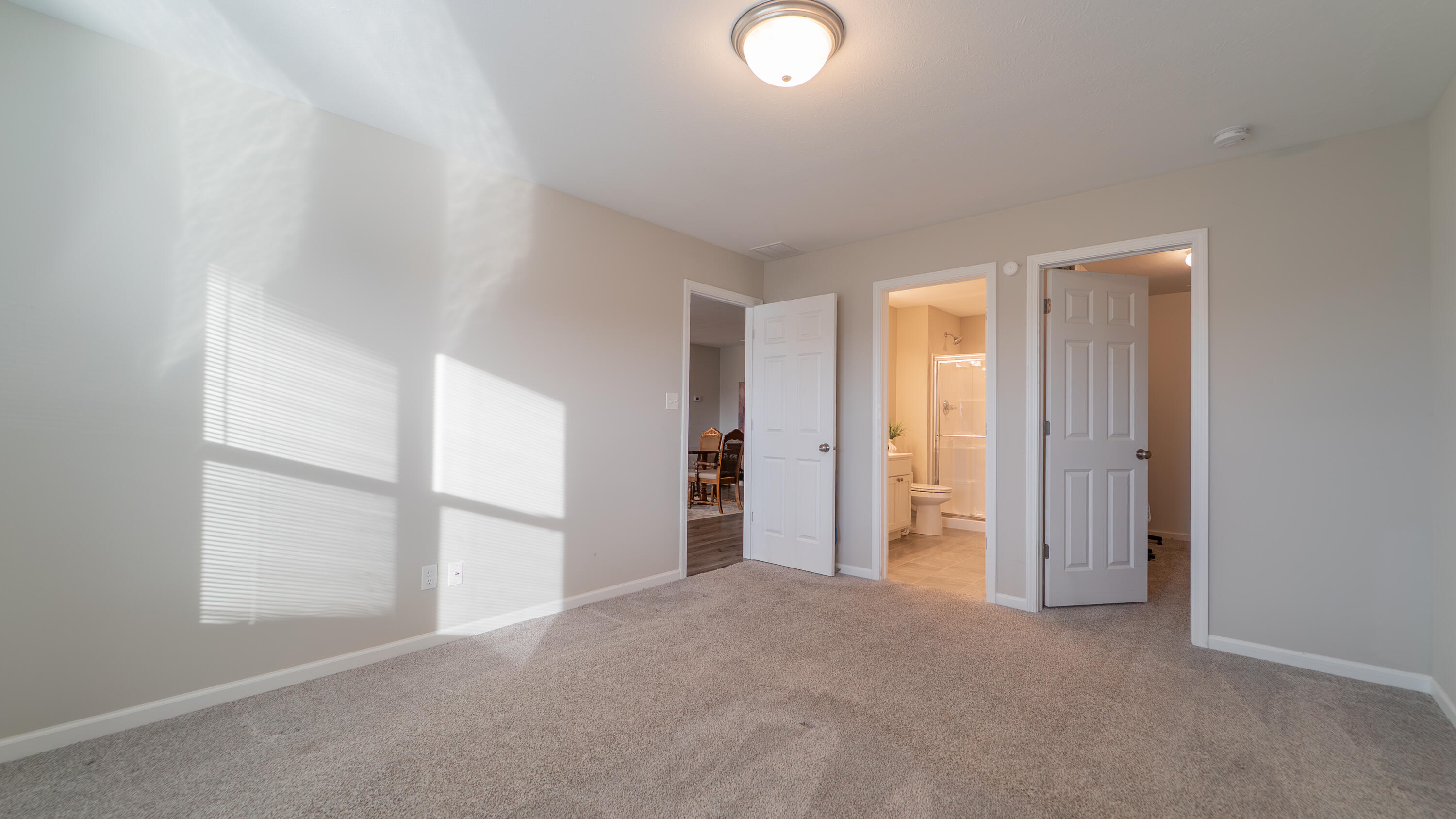 11792 Rhode Island Street Crown Point, IN 46307 - Photo 23 of 30 an empty room with a window and a kitchen