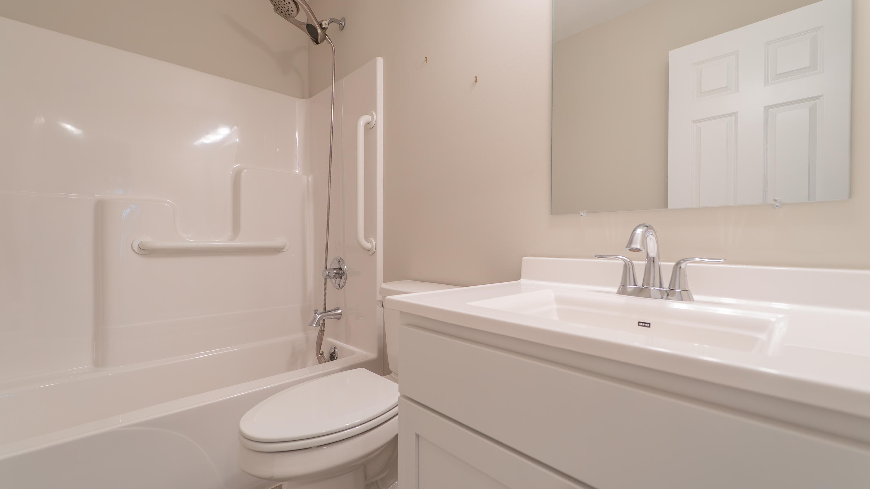 11792 Rhode Island Street Crown Point, IN 46307 - Photo 25 of 30 a bathroom with a sink a toilet and shower
