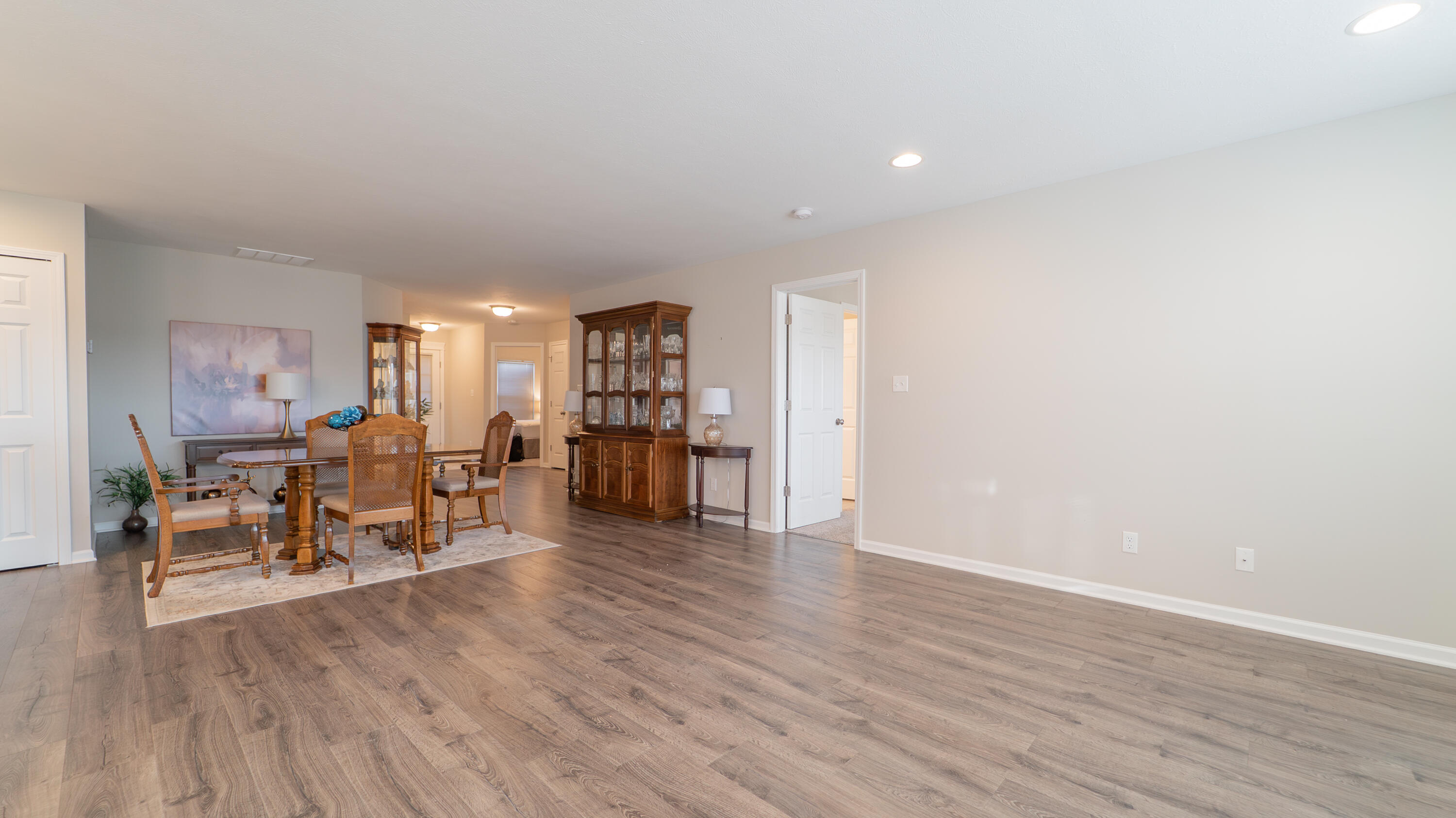11792 Rhode Island Street Crown Point, IN 46307 - Photo 8 of 30 a living room with furniture and a wooden floor