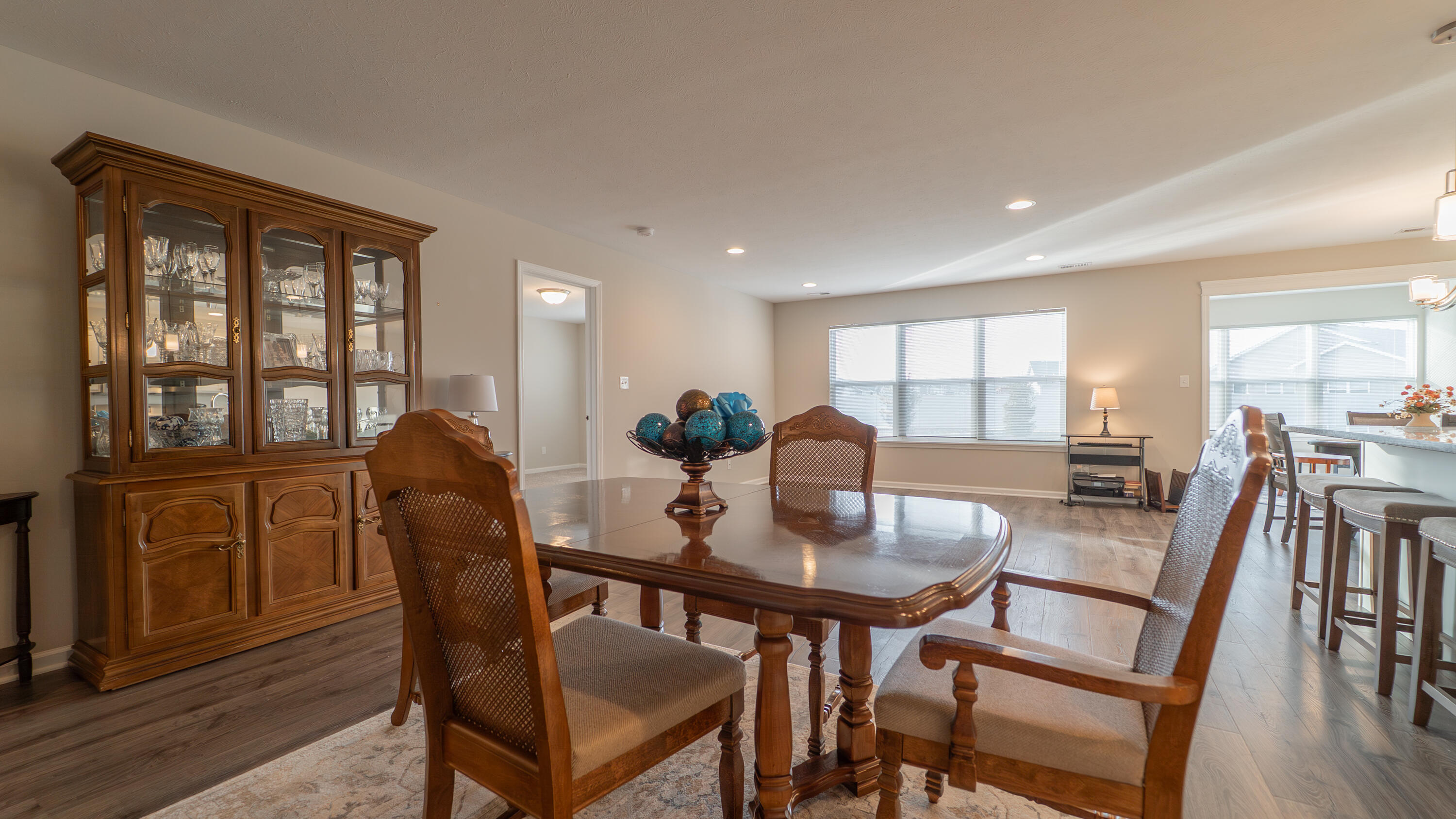 11792 Rhode Island Street Crown Point, IN 46307 - Photo 9 of 30 a view of a dining room with furniture window and wooden floor
