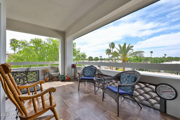 a patio with table and chairs