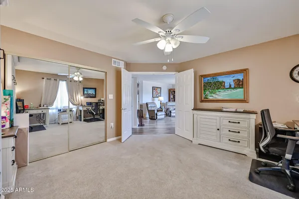 a view of a livingroom with furniture and a window