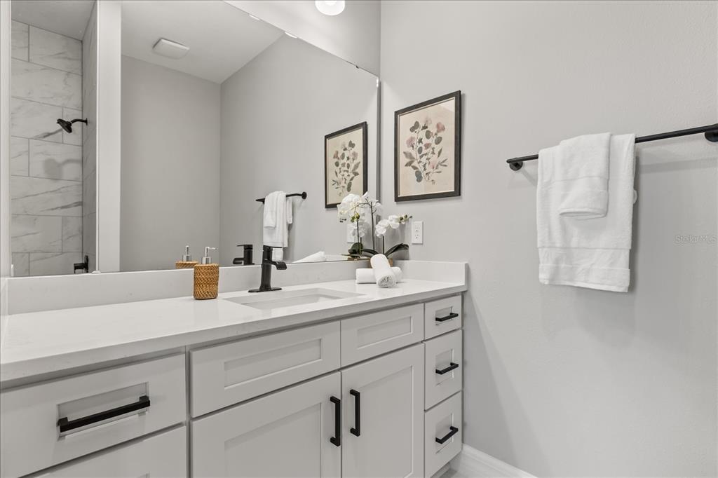 14367 English Sparrow Road Brooksville, FL 34614 - Photo 15 of 30 a bathroom with a sink and a mirror