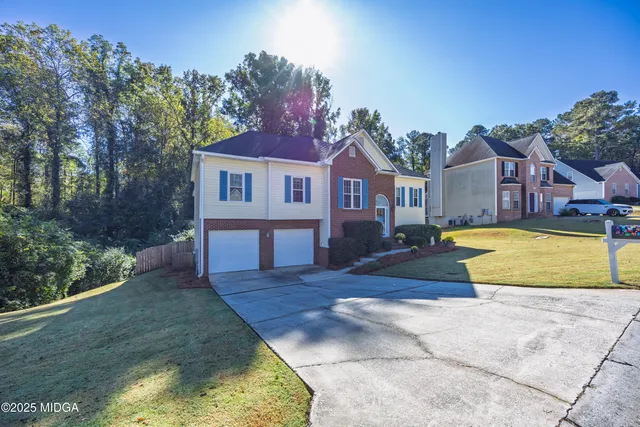 a view of a house with swimming pool in front of it