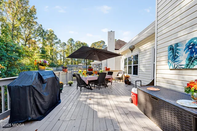 a view of balcony with outdoor seating and wooden floor