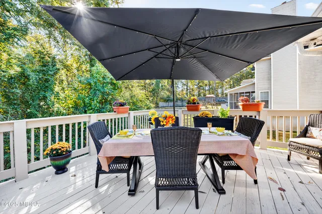 a view of balcony with seating space and barbeque oven