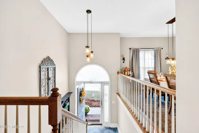 a view of an entryway with wooden floor