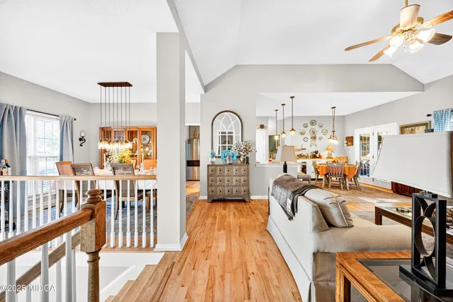 a view of a living room and dining room