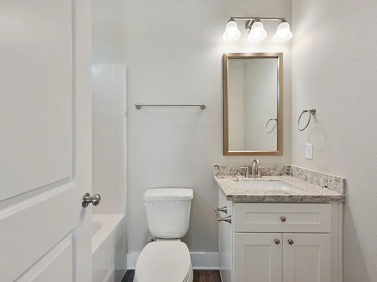 407 Ash Street College Station, TX 77840 - Photo 11 of 14 Full bath featuring vanity and bathing tub / shower combination