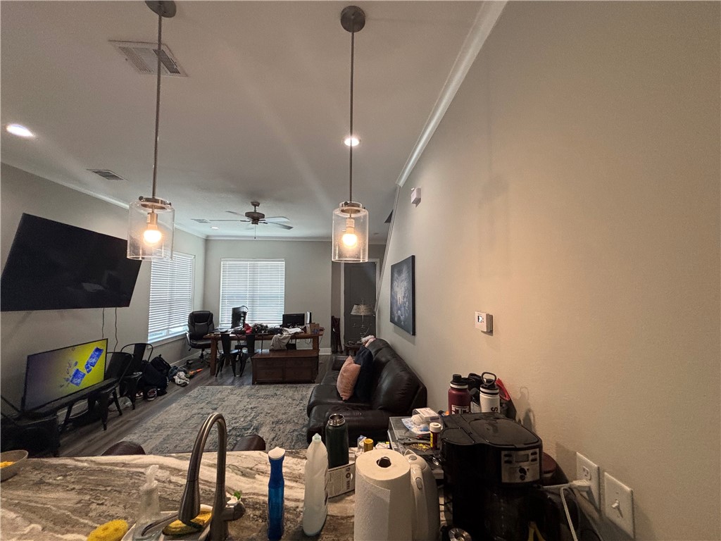 407 Ash Street College Station, TX 77840 - Photo 7 of 14 Living area with crown molding, wood finished floors, an office area, and recessed lighting