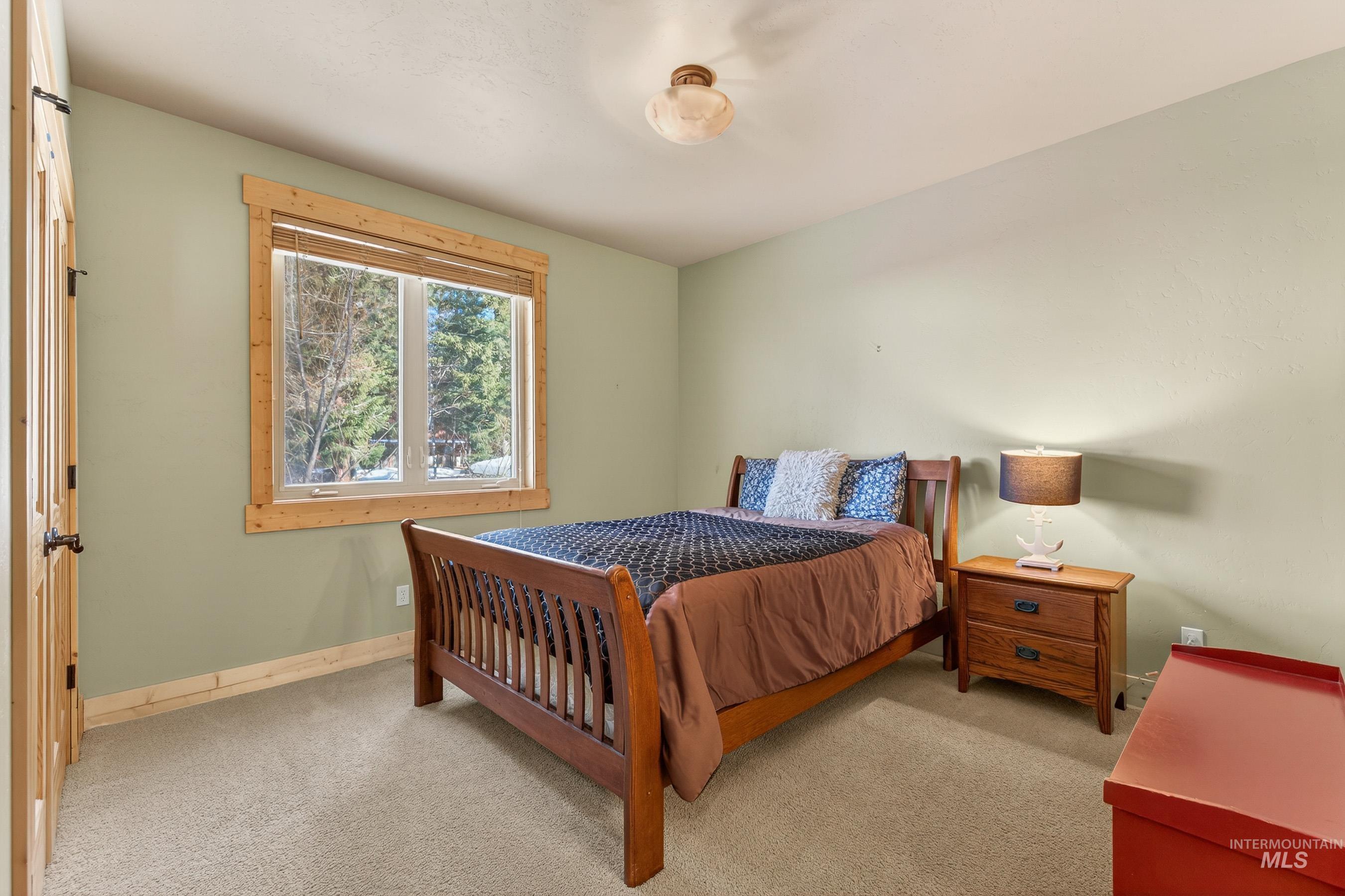 722 Lick Creek Road, Unit 8 McCall, ID 83638 - Photo 21 of 50 Bedroom featuring light carpet