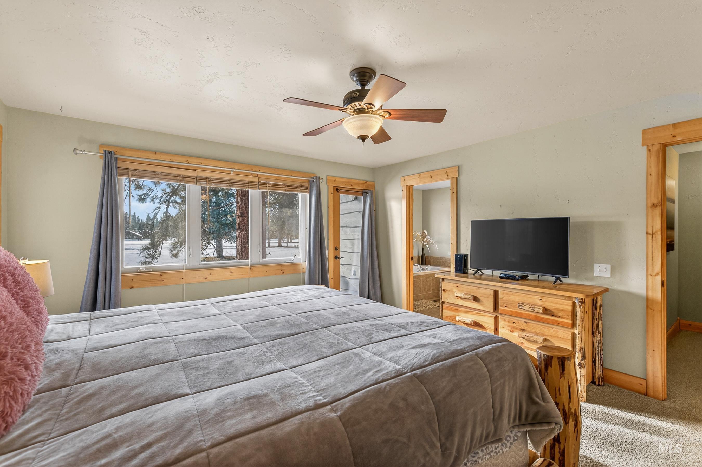 722 Lick Creek Road, Unit 8 McCall, ID 83638 - Photo 25 of 50 Carpeted bedroom with a ceiling fan and baseboards