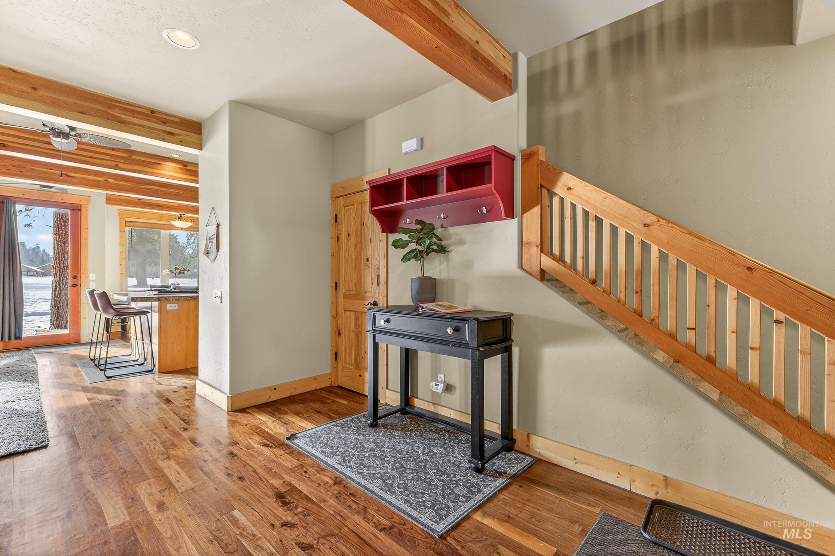 722 Lick Creek Road, Unit 8 McCall, ID 83638 - Photo 4 of 50 Entrance foyer featuring beam ceiling, light wood-style floors, recessed lighting, and stairway