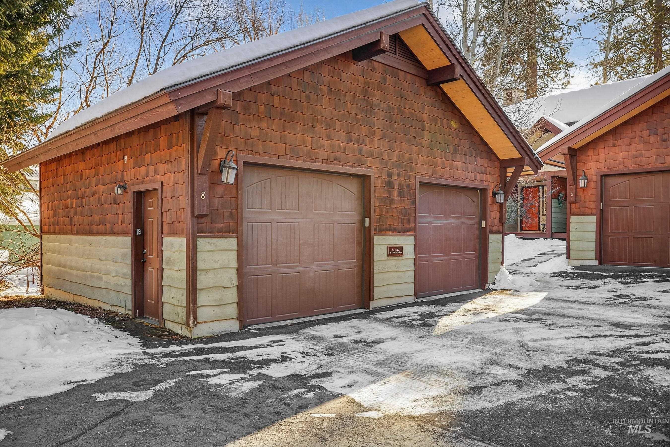 722 Lick Creek Road, Unit 8 McCall, ID 83638 - Photo 44 of 50 Snow covered garage with a garage