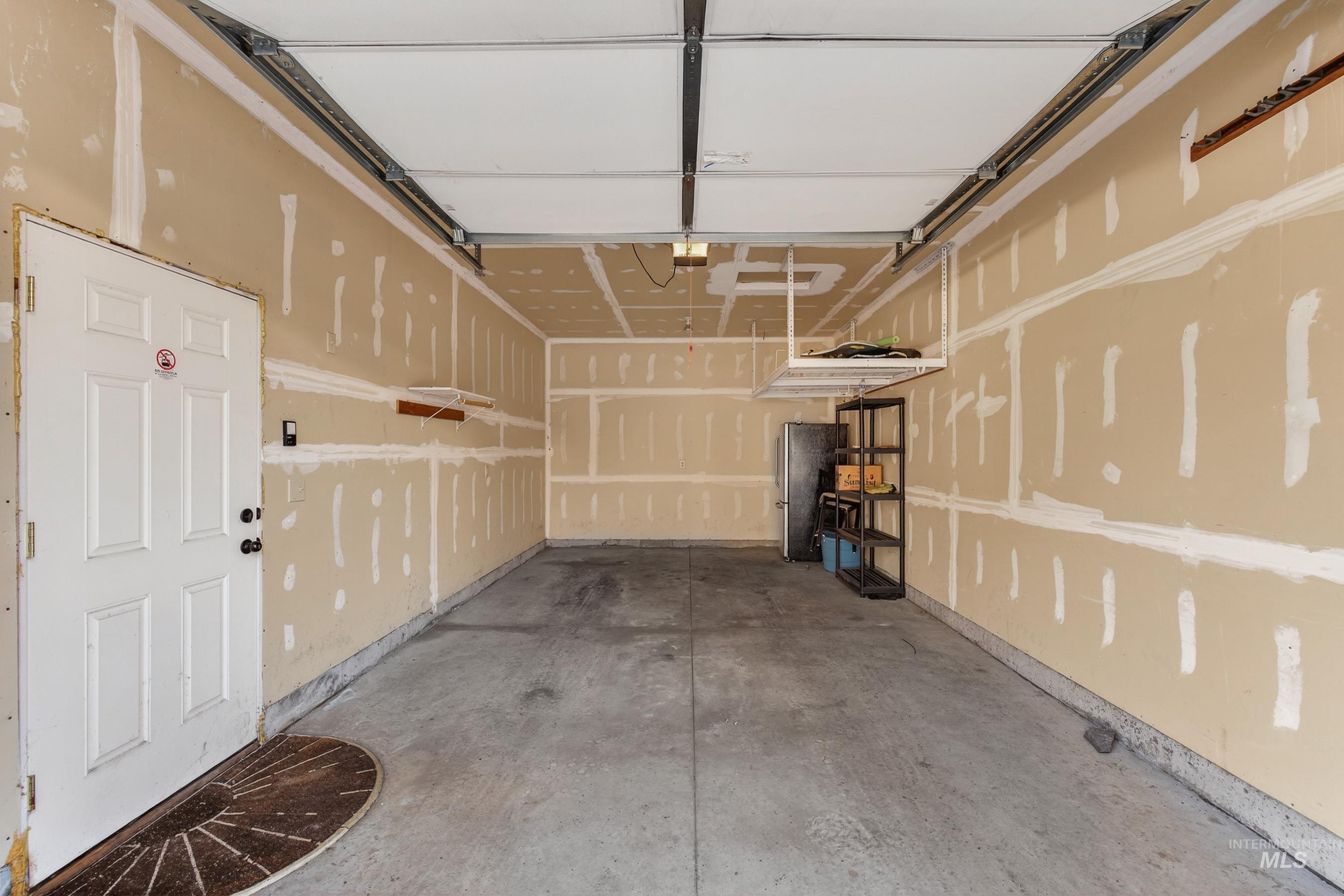 722 Lick Creek Road, Unit 8 McCall, ID 83638 - Photo 45 of 50 Garage with freestanding refrigerator