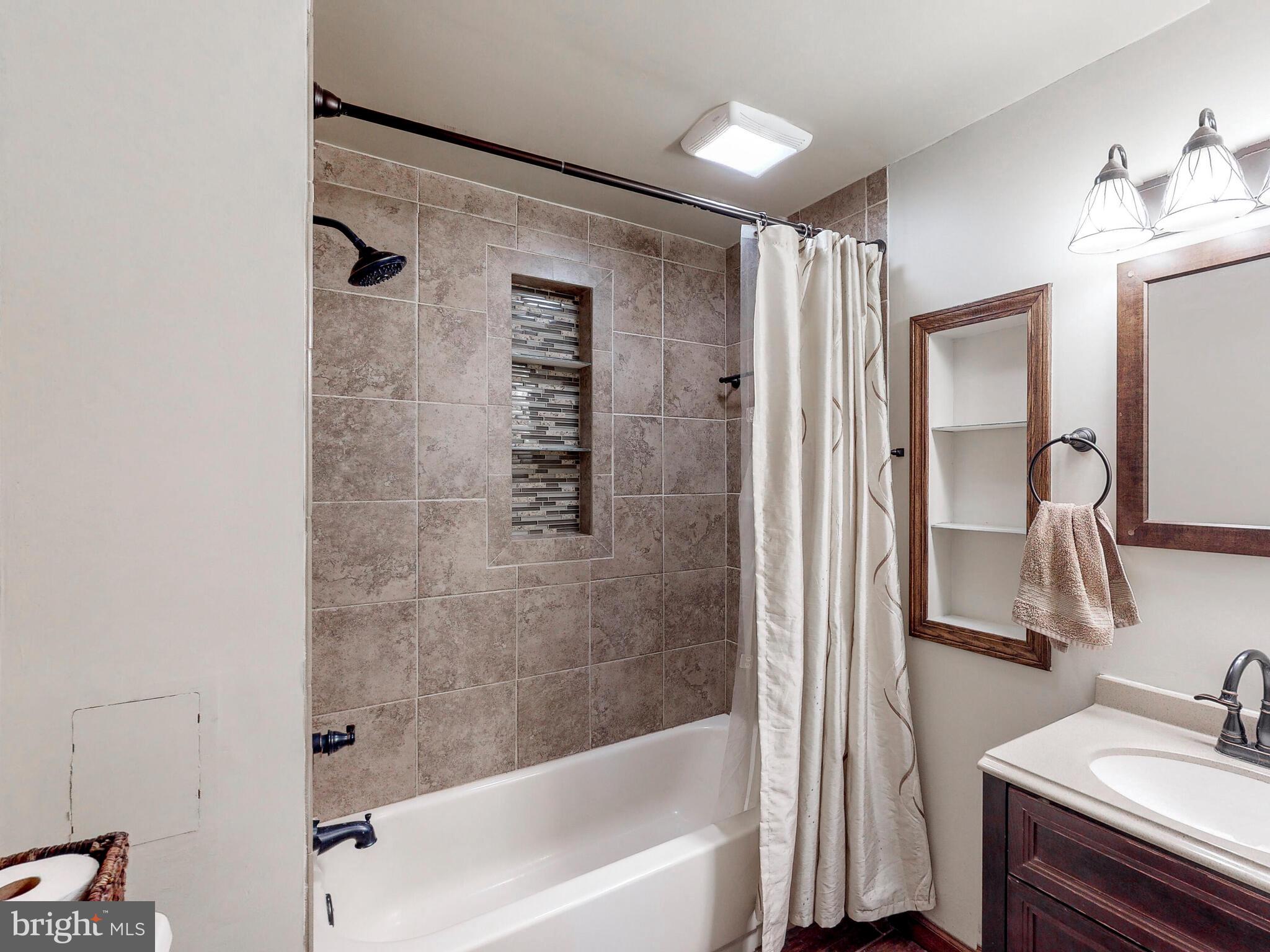 3121 Tucker Road Street, MD 21154 - Photo 28 of 50 lower level hallway full bathroom