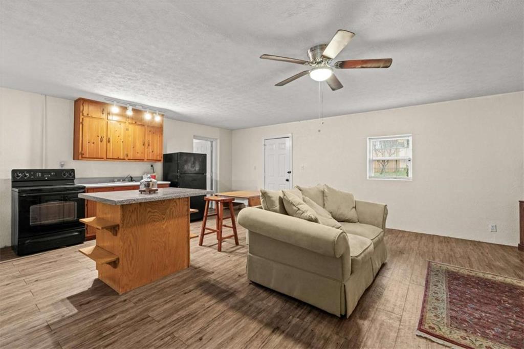 40-l Z L Z Jackson Road Bowdon, GA 30108 - Photo 11 of 25 a living room with furniture and kitchen view