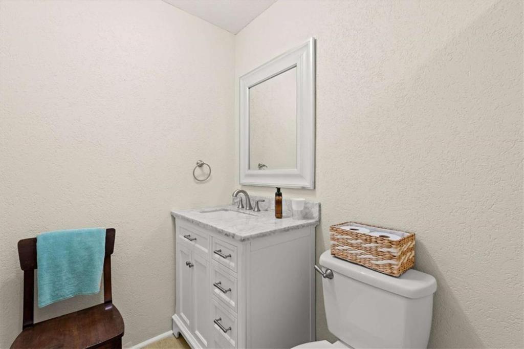40-l Z L Z Jackson Road Bowdon, GA 30108 - Photo 16 of 25 a bathroom with a toilet sink and mirror