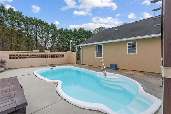 a house view with a swimming pool