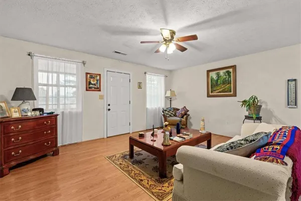 a living room with furniture and window