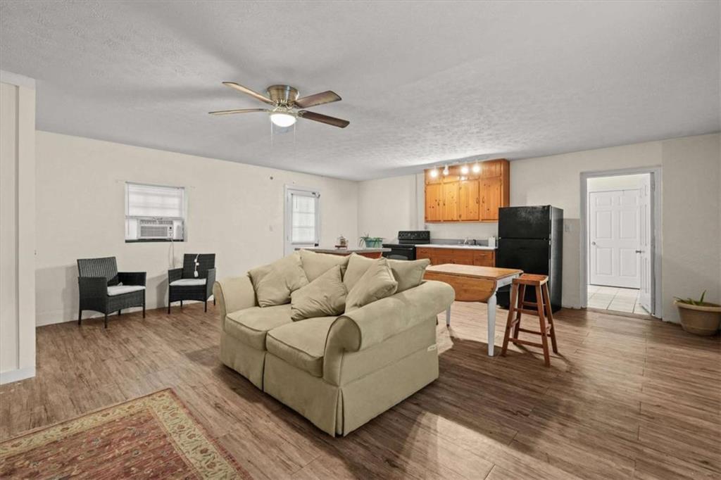 40-l Z L Z Jackson Road Bowdon, GA 30108 - Photo 10 of 25 a living room with furniture and wooden floor