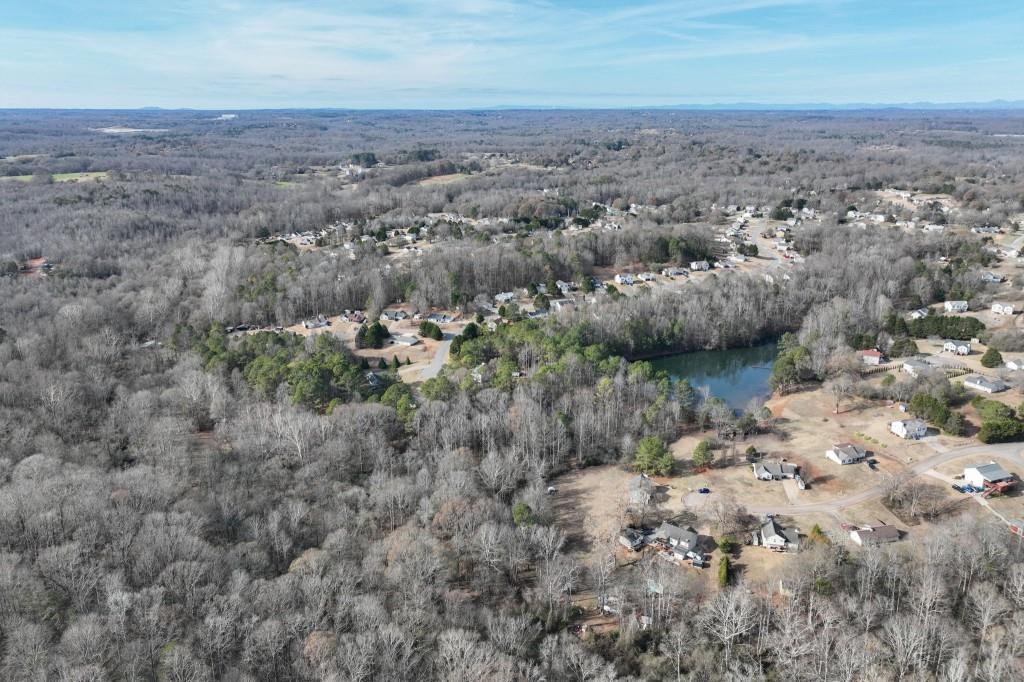 Lot 12 Rolling Ridge Drive Gillsville, GA 30543 - Photo 5 of 18 an aerial view of house with yard and mountain in the background