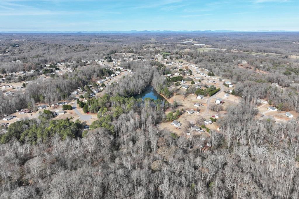 Lot 12 Rolling Ridge Drive Gillsville, GA 30543 - Photo 6 of 18 an aerial view of house with yard and mountain view in back