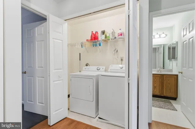 a bathroom with a sink mirror and vanity