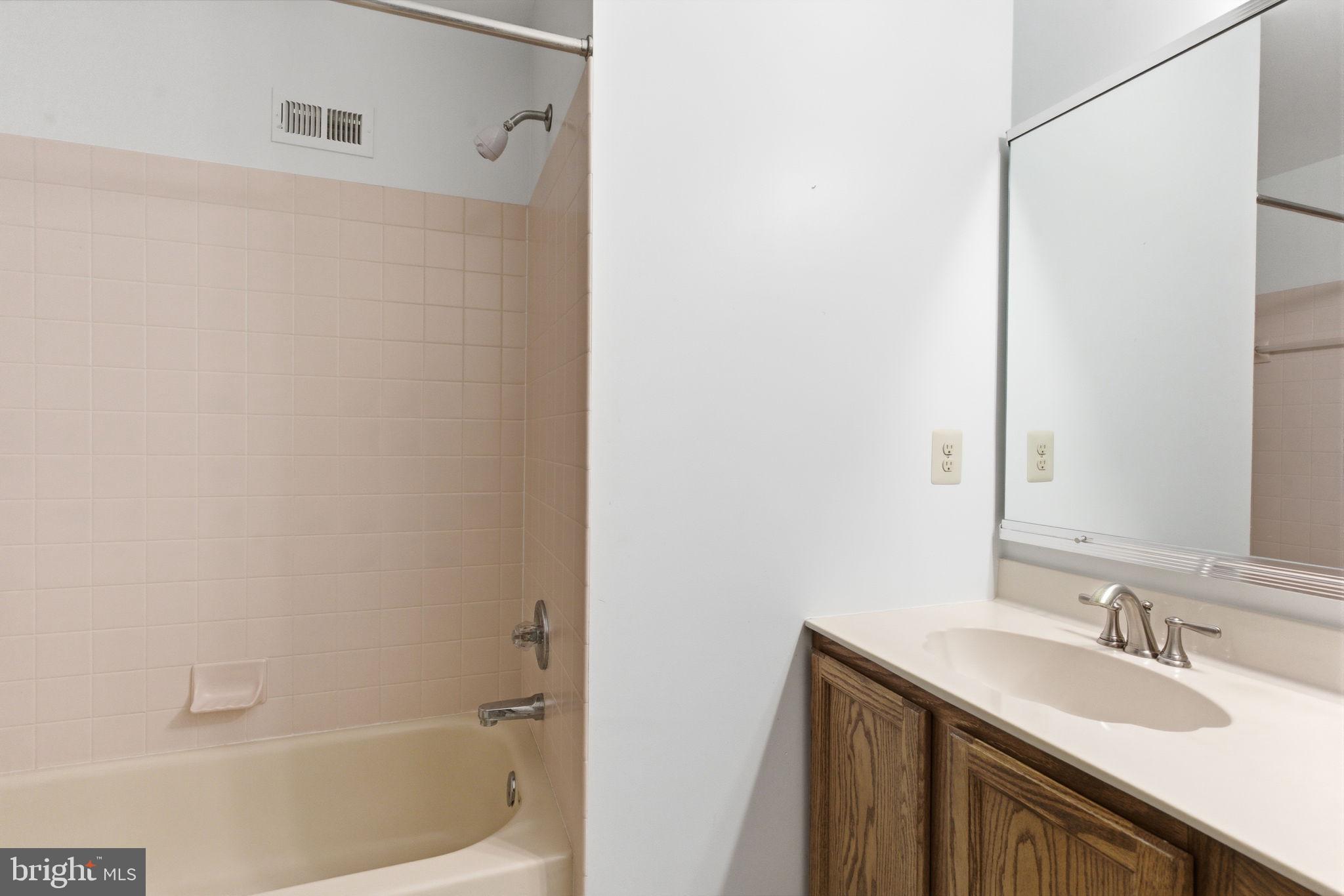 100 Bishops Gate Lane Doylestown, PA 18901 - Photo 21 of 33 a bathroom with a sink and a bathtub