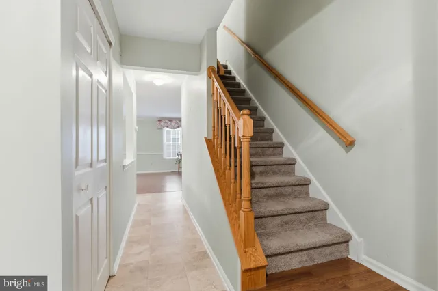 a view of staircase with wooden floor and stairs