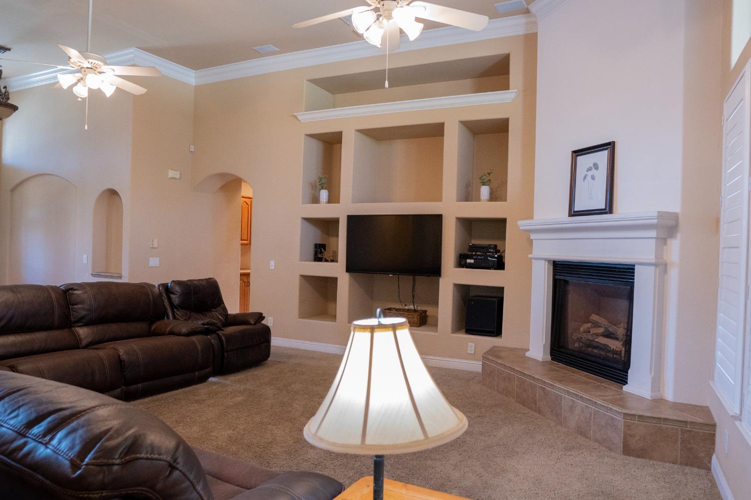2607 Norwich Avenue Clovis, CA 93611 - Photo 12 of 55 a living room with furniture and a fireplace