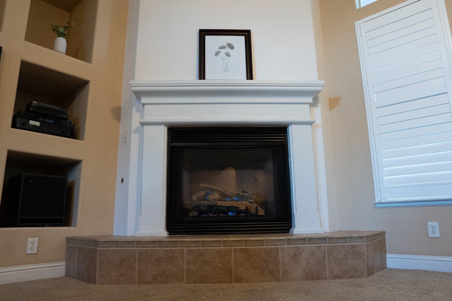 2607 Norwich Avenue Clovis, CA 93611 - Photo 14 of 55 a living room with a fireplace