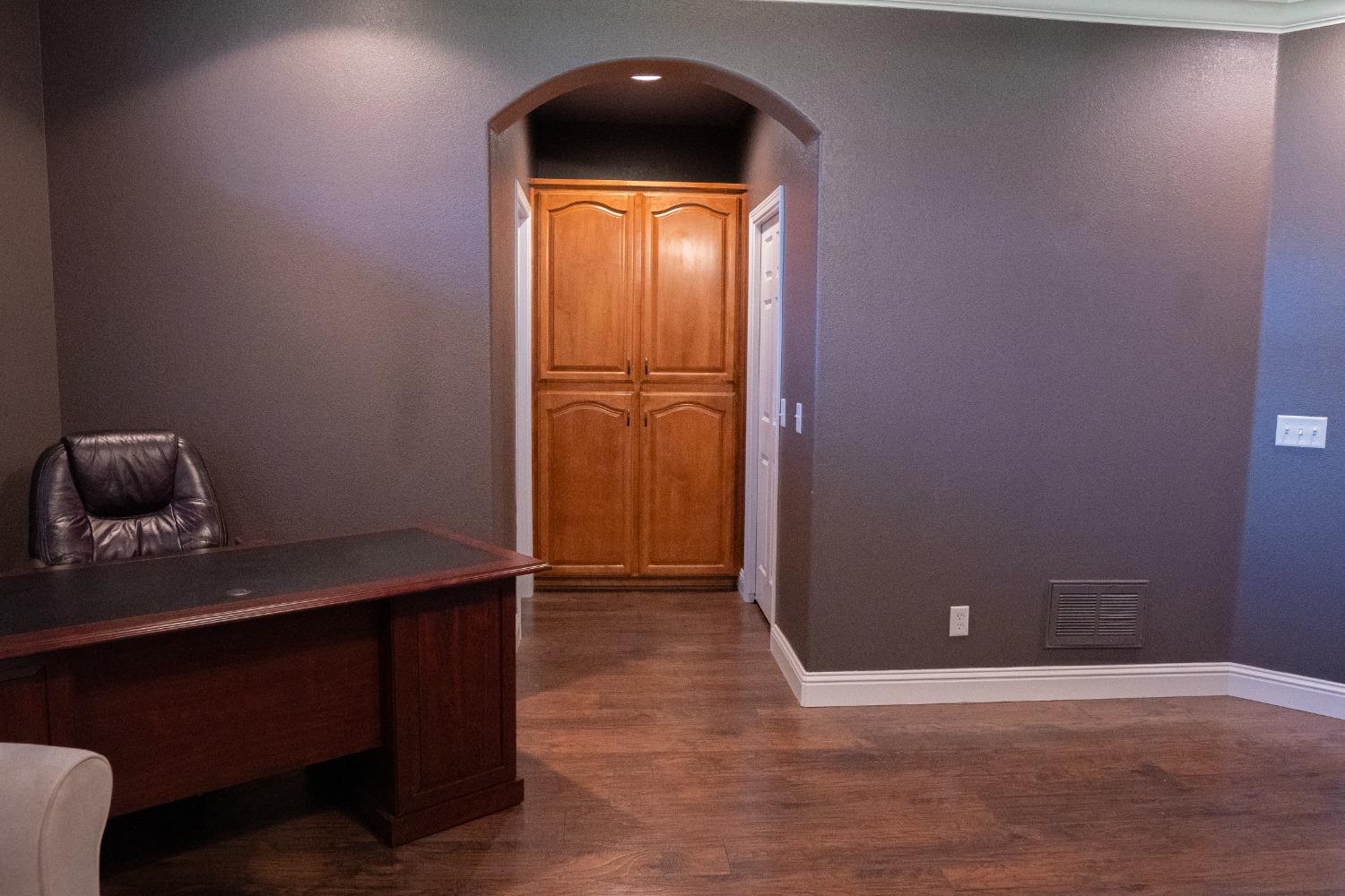 2607 Norwich Avenue Clovis, CA 93611 - Photo 24 of 55 a view of a livingroom with wooden floor and a cabinet