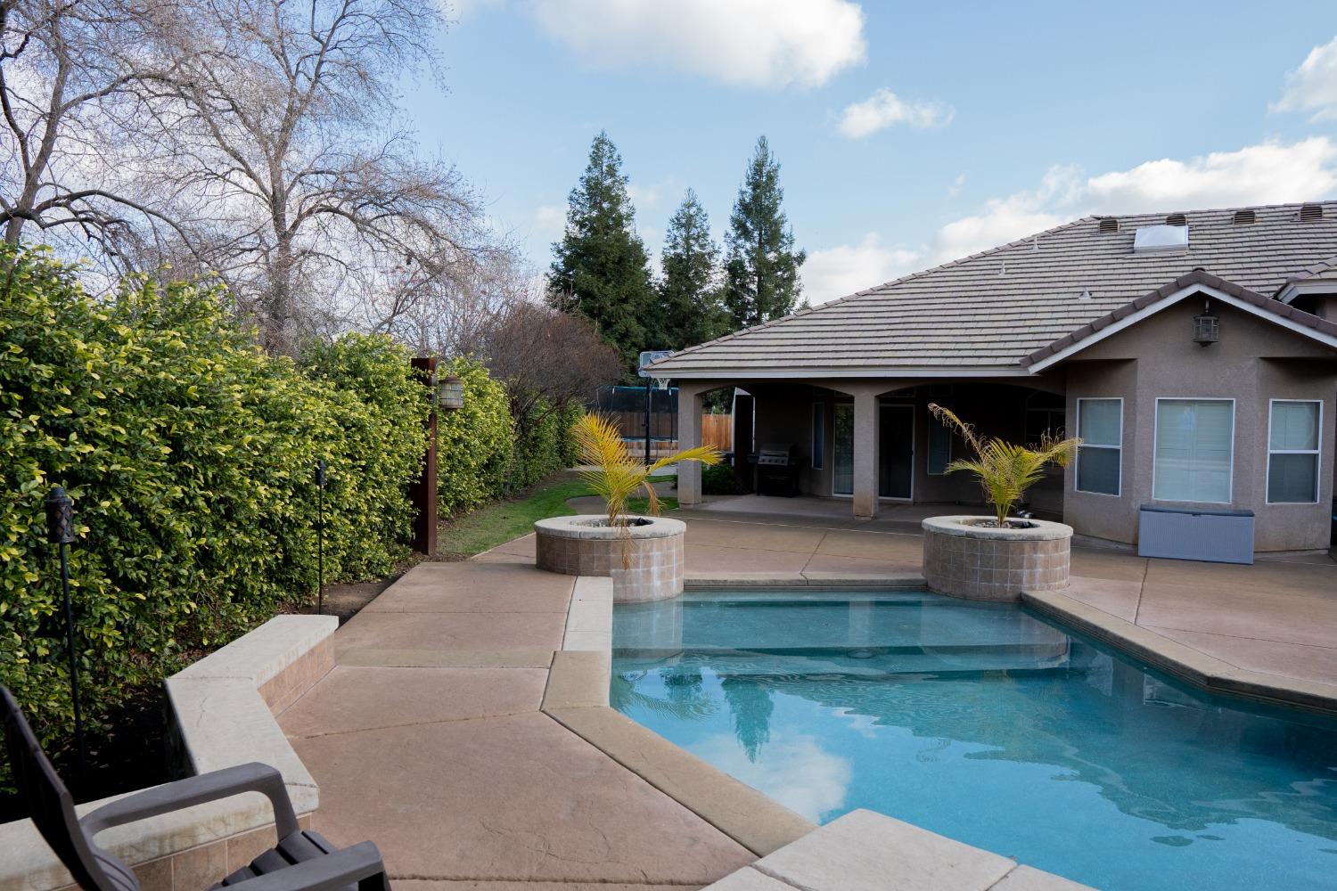 2607 Norwich Avenue Clovis, CA 93611 - Photo 43 of 55 a view of a house with couches and potted plants