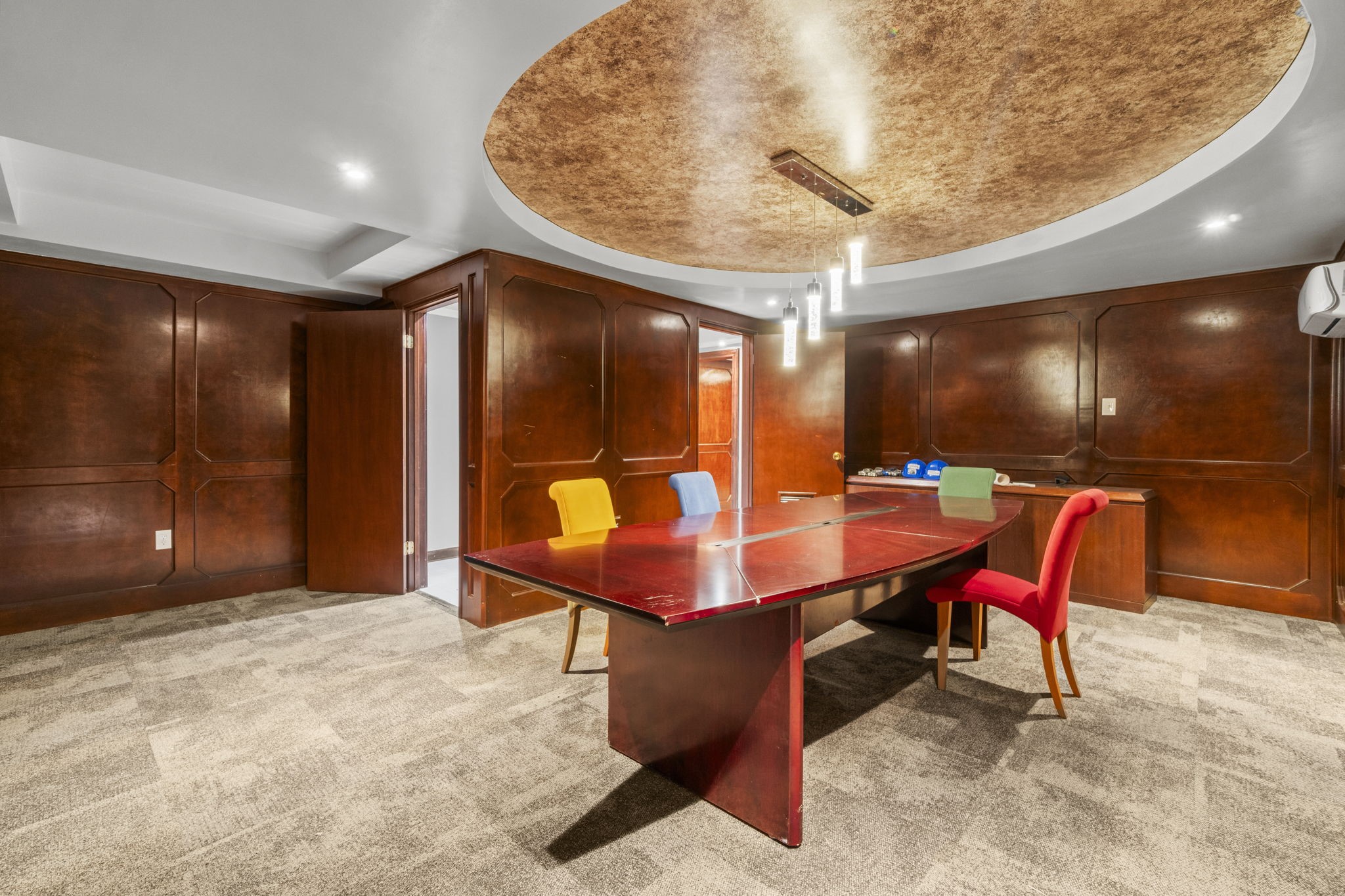 1018 Shaver Street Pasadena, TX 77506 - Photo 15 of 43 Large boardroom or meeting space with wood paneling and accent ceiling.