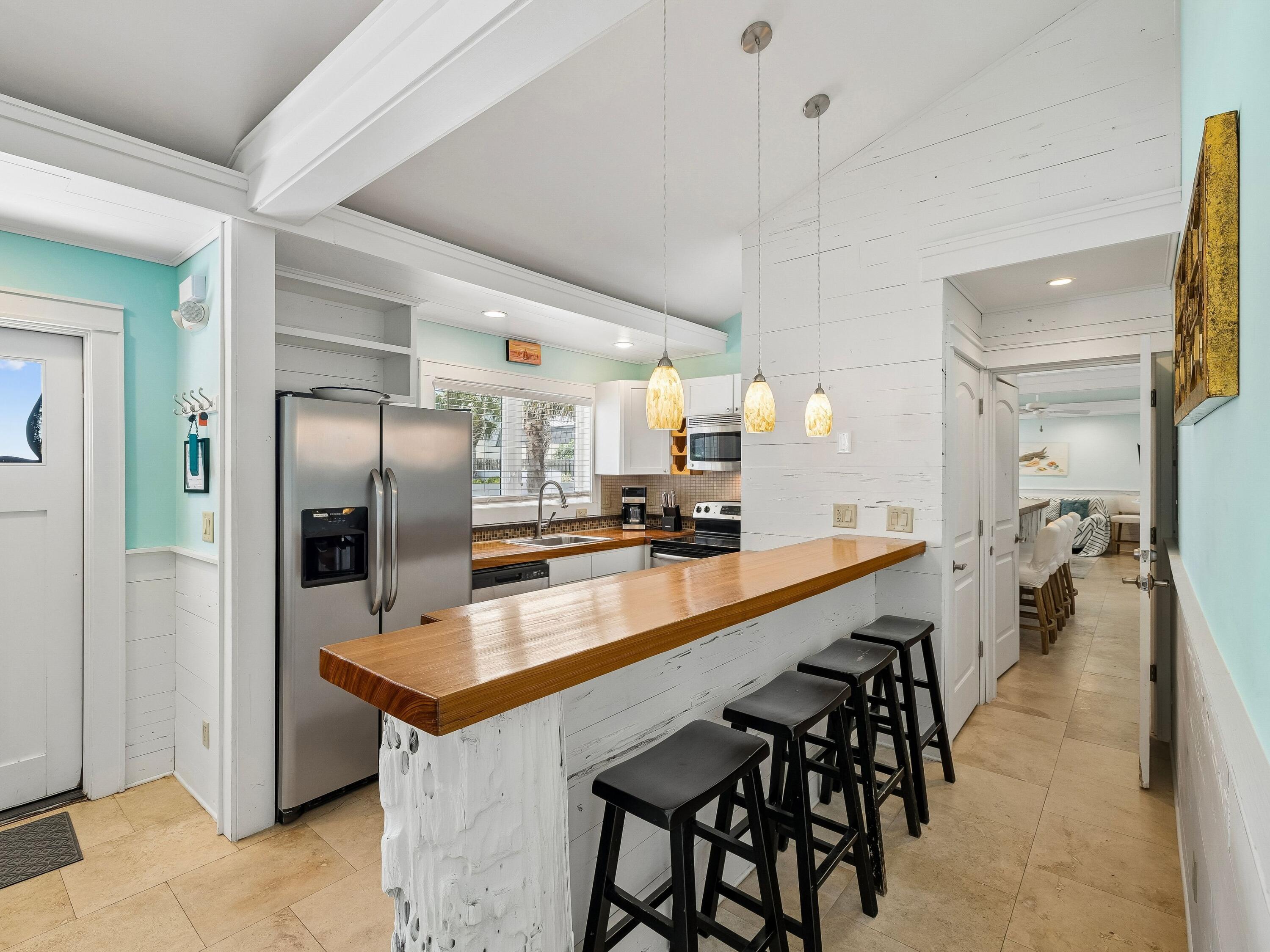 36 Green Street Inlet Beach, FL 32461 - Photo 7 of 27 a large kitchen with granite countertop a counter space a sink and stainless steel appliances