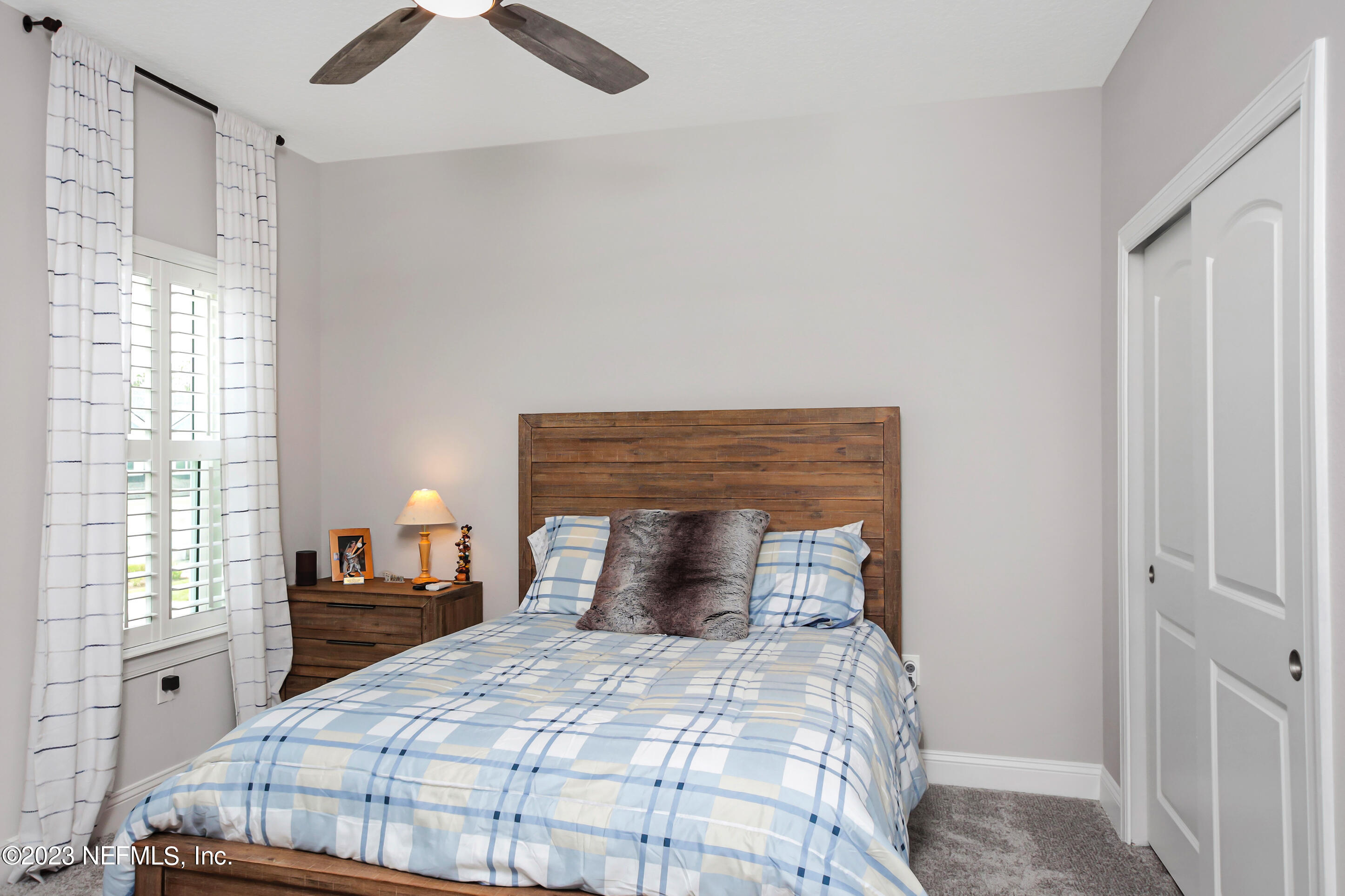 67 Carousel Drive Ponte Vedra, FL 32081 - Photo 19 of 30 a bedroom with a bed and a window