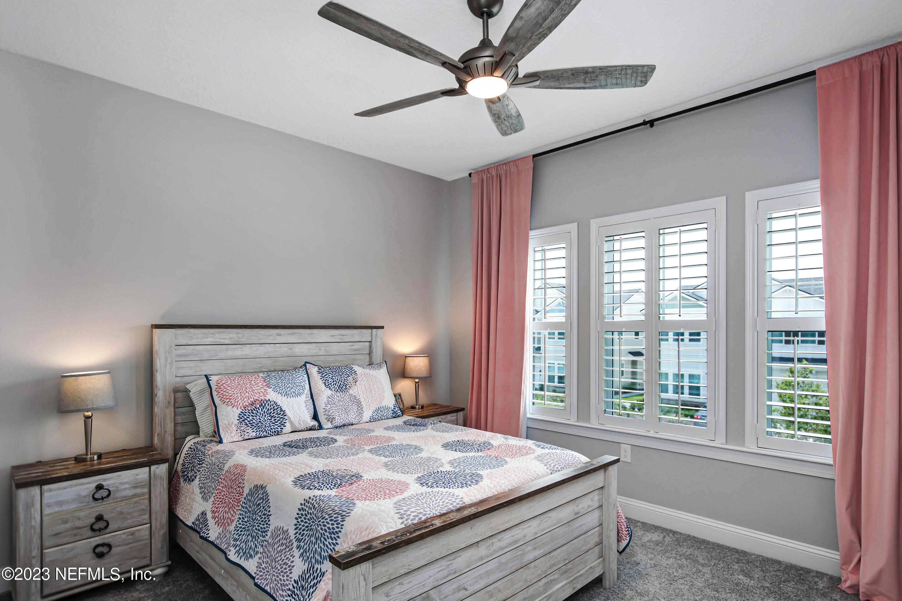 67 Carousel Drive Ponte Vedra, FL 32081 - Photo 22 of 30 a bedroom with a large bed and a window