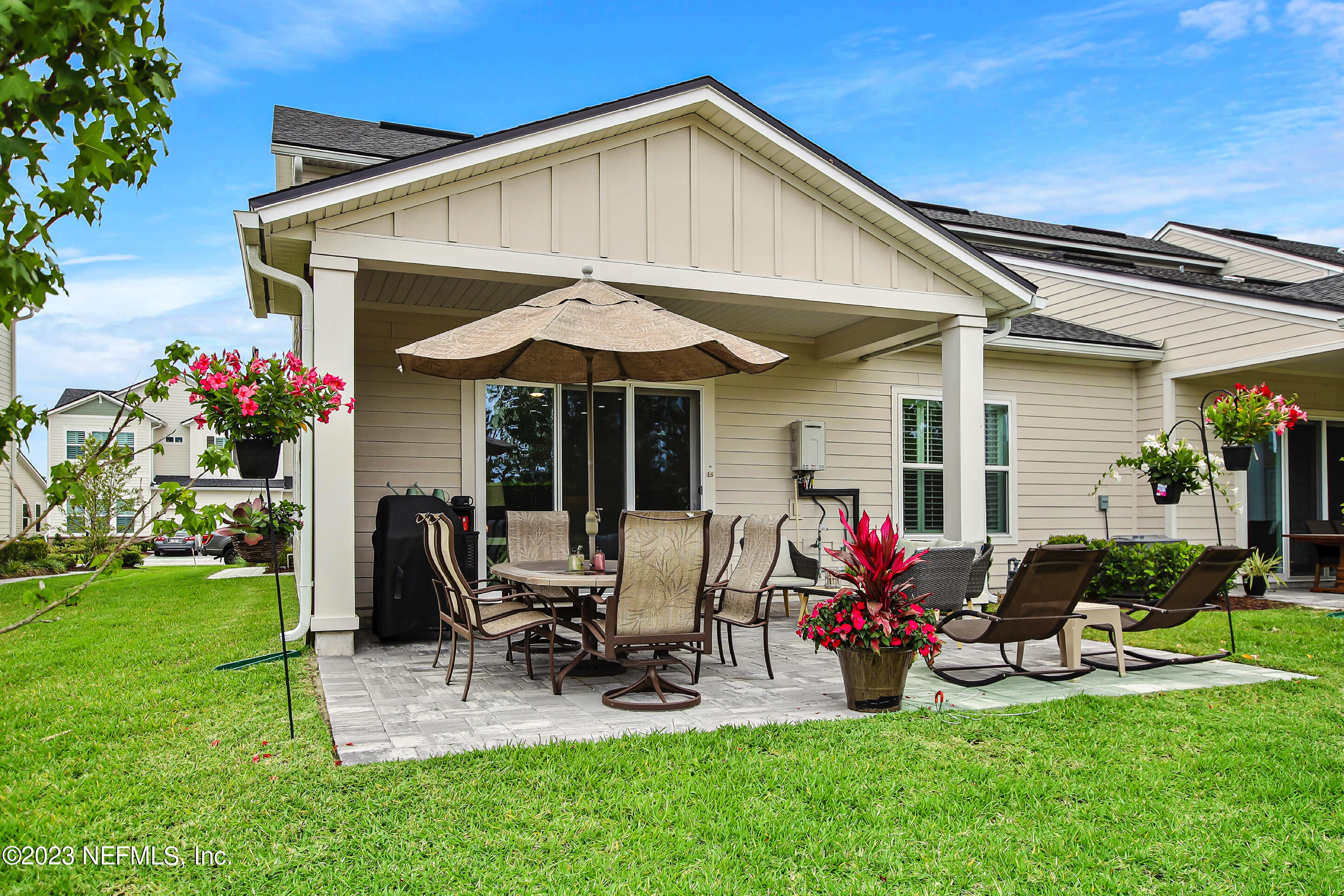 67 Carousel Drive Ponte Vedra, FL 32081 - Photo 28 of 30 a view of a house with backyard and porch