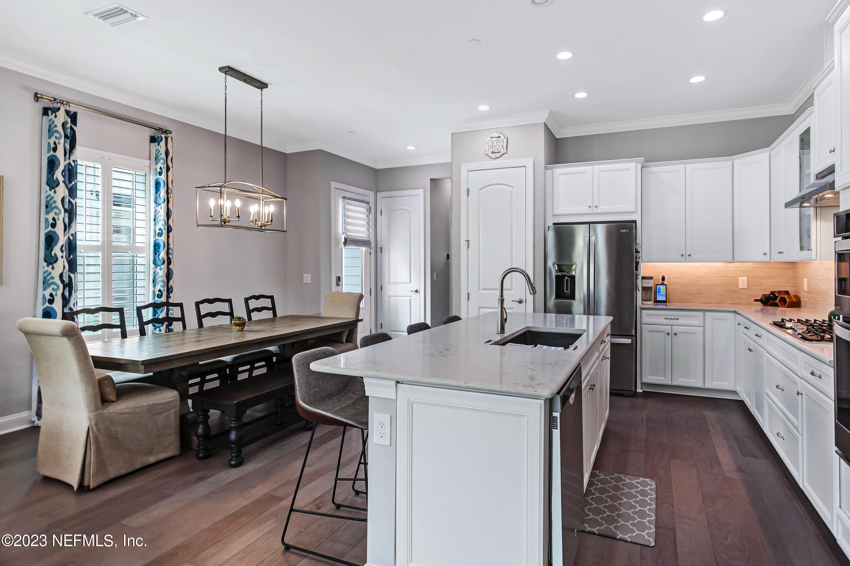 67 Carousel Drive Ponte Vedra, FL 32081 - Photo 3 of 30 a kitchen that has a lot of cabinets a sink and a refrigerator